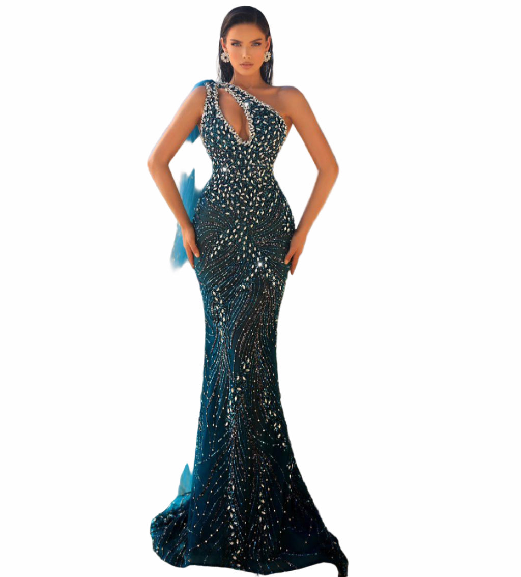 Woman in a black sequined gown with a blue train 