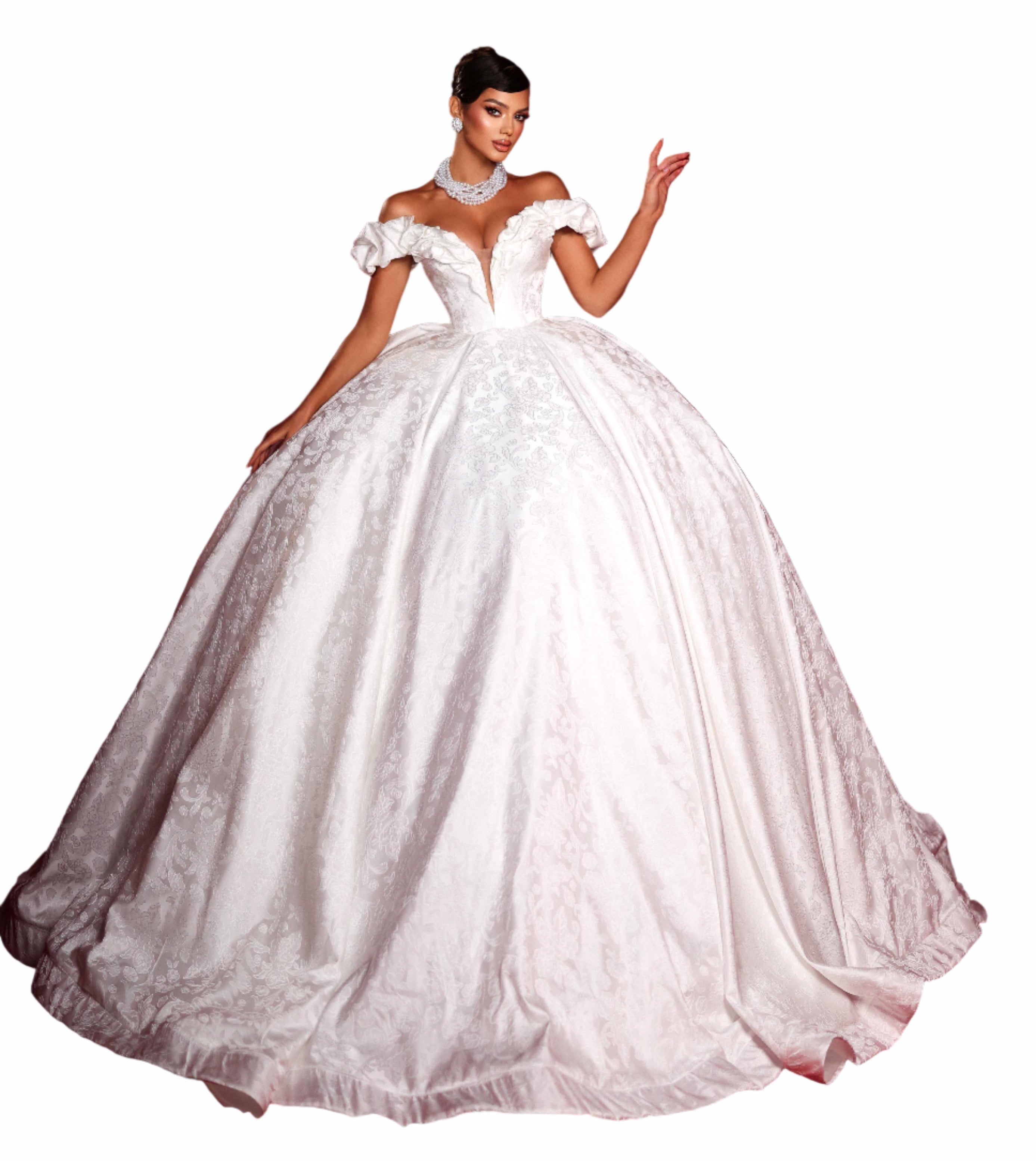 Woman in a white wedding dress standing in front of red curtains