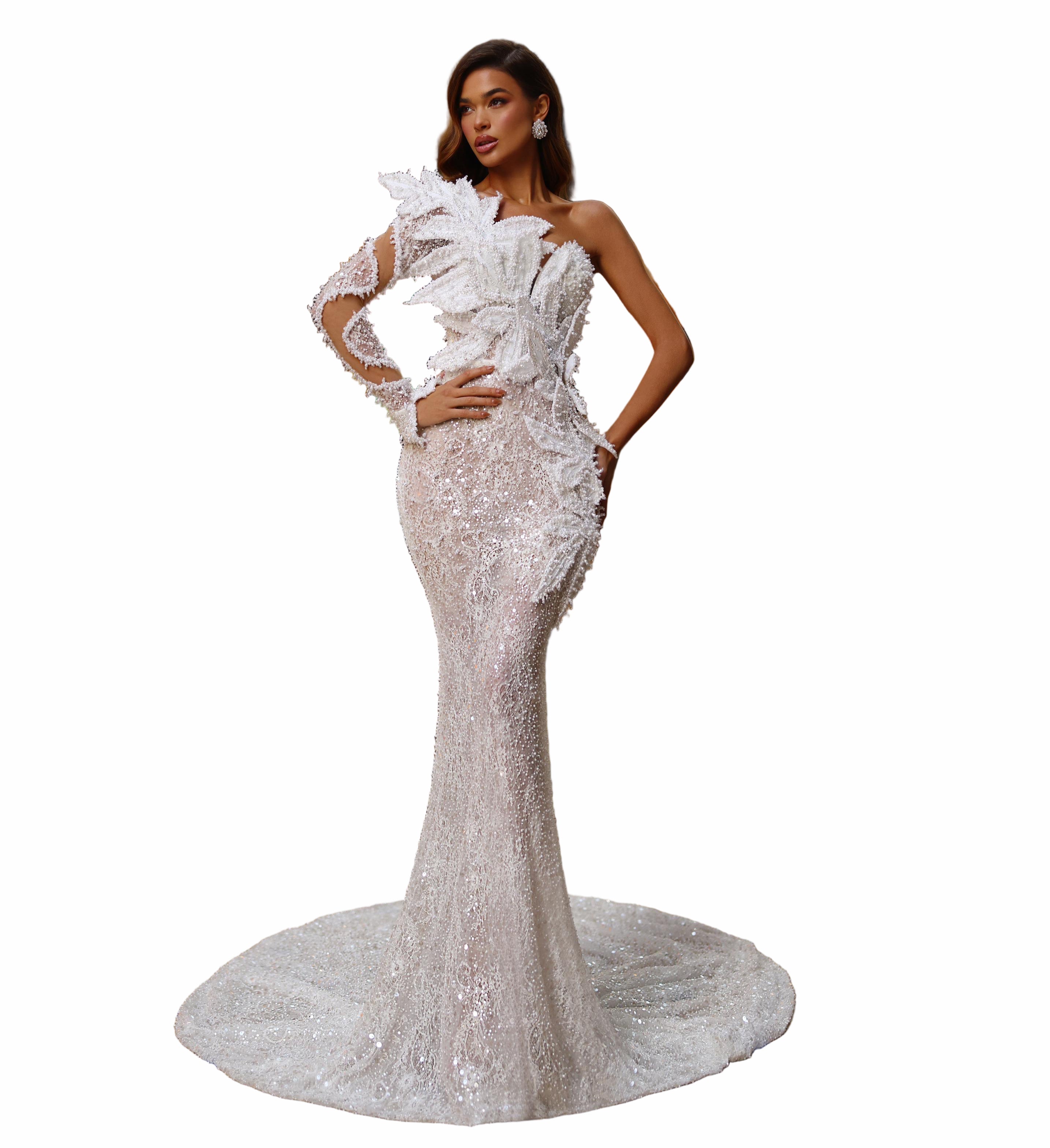 Woman in a white evening gown standing in a grand architectural interior.