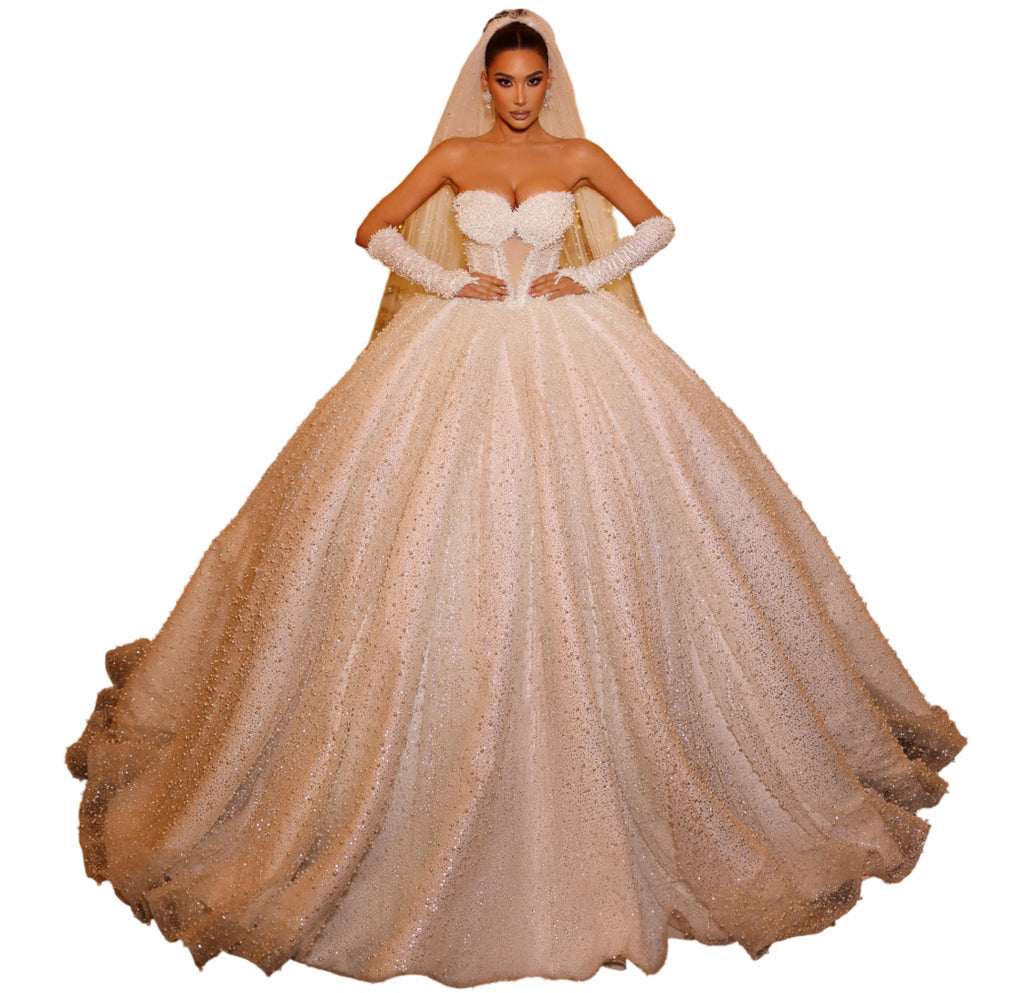 Woman in a white strapless gown with a full skirt 