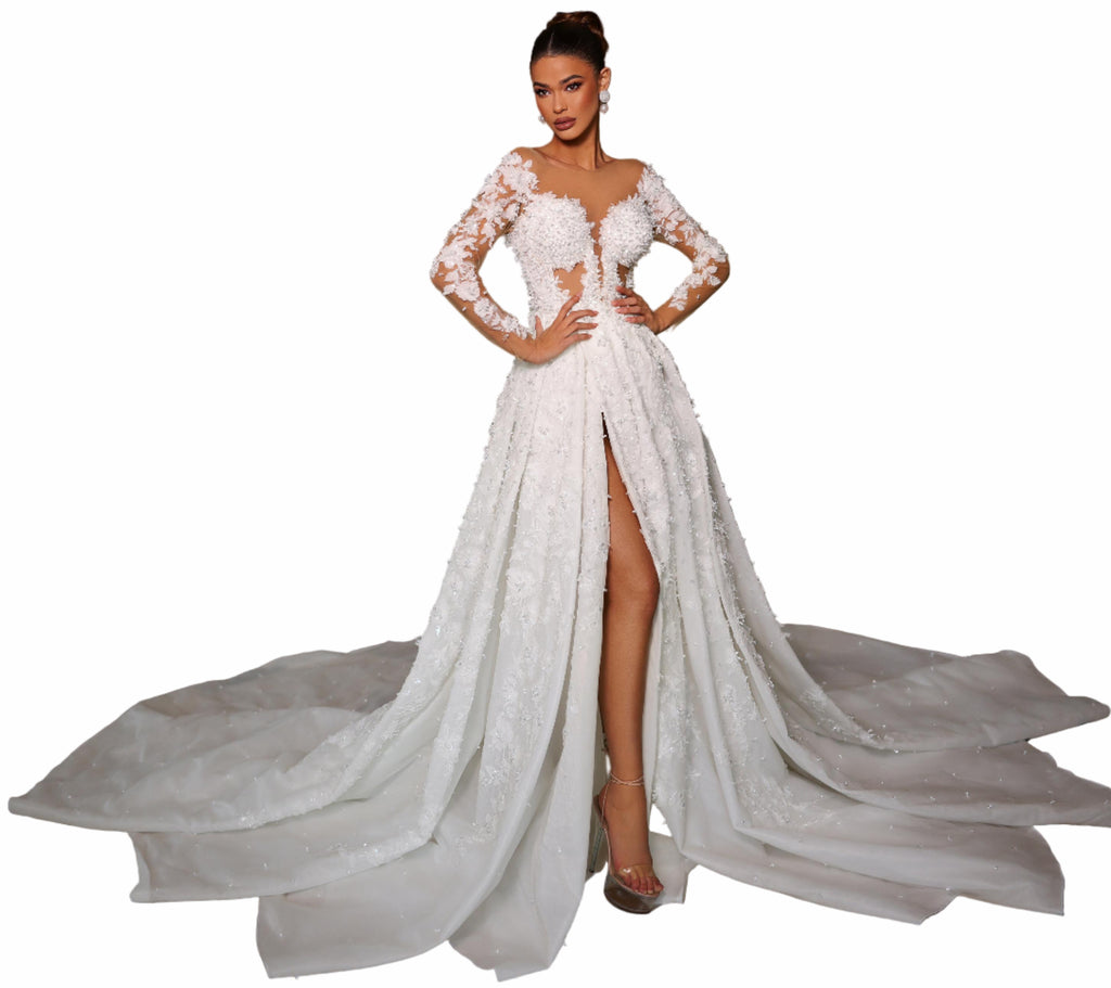 Woman in a white wedding dress with a high slit 