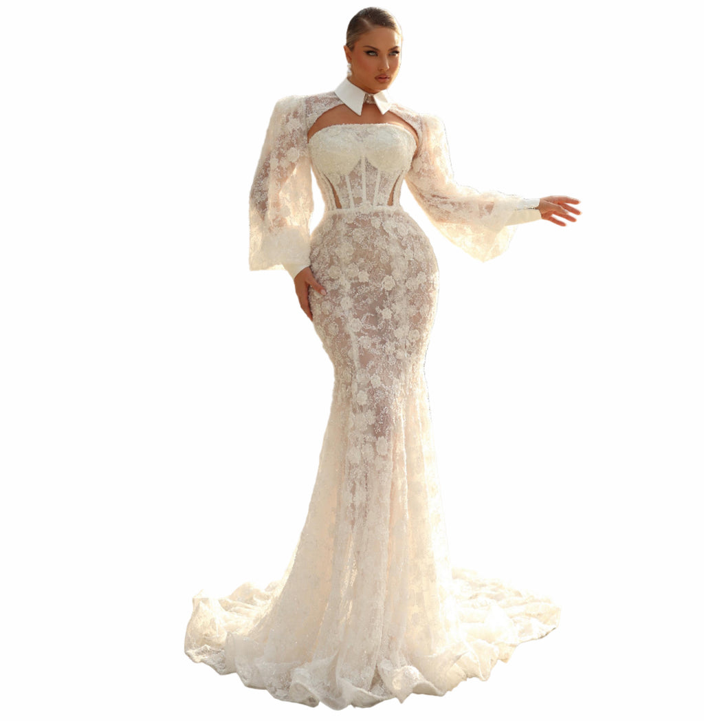 Woman in a white lace dress standing 